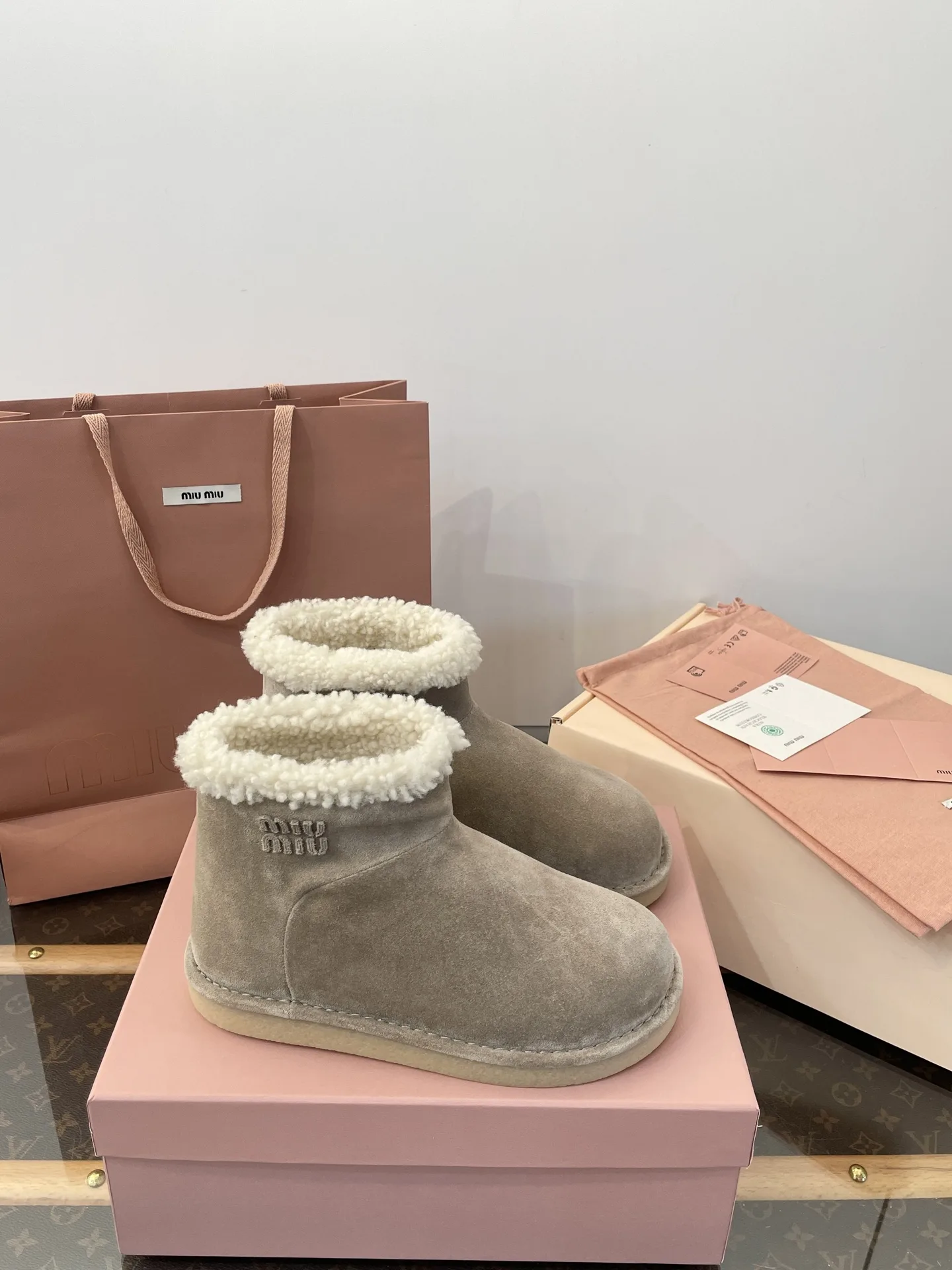 miumiu Suede and shearling booties